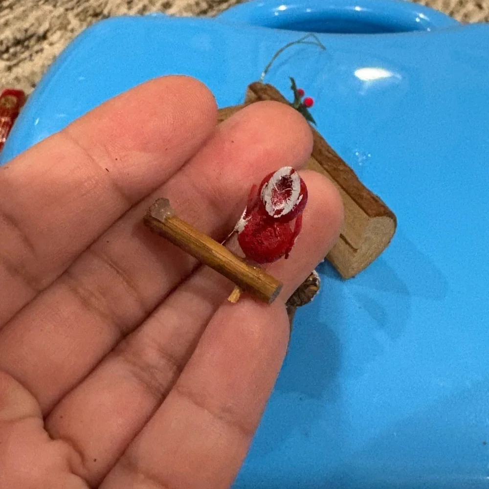 Christmas ornament depicting a wooden bird house clock